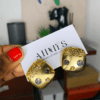Gold earring with stones