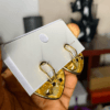 Gold earring with stones